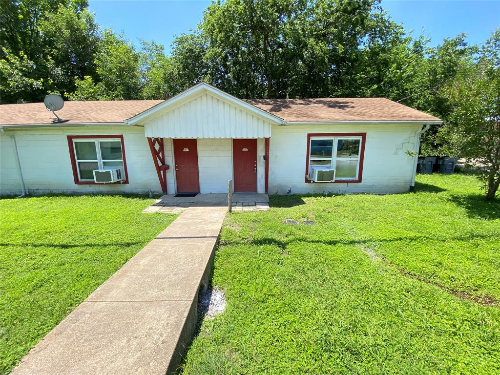1203 Hall Street Lancaster, TX 75146 - Photo 1 of 11 a front view of house with yard and green space