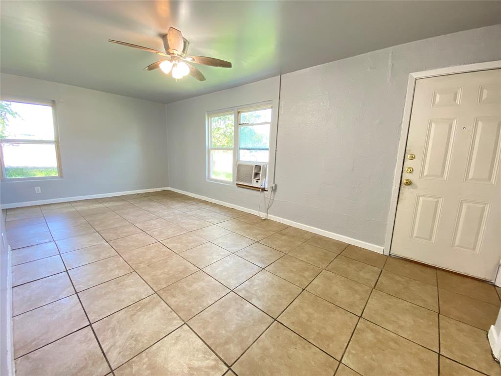 1203 Hall Street Lancaster, TX 75146 - Photo 3 of 11 a view of an empty room with a window