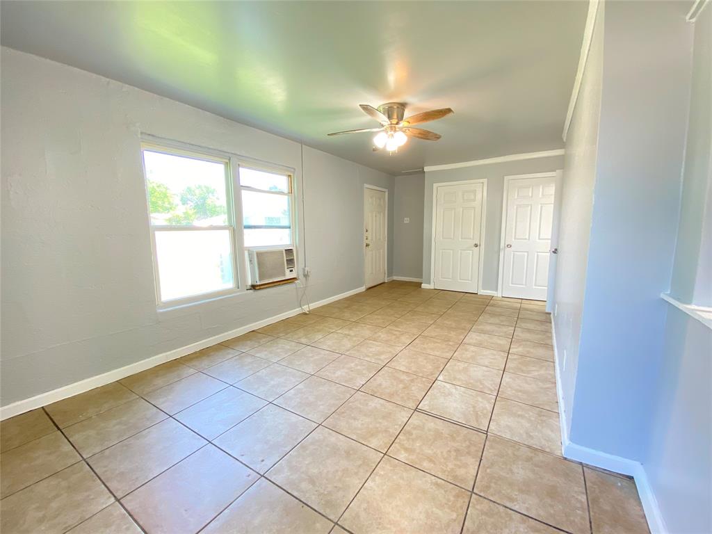 1203 Hall Street Lancaster, TX 75146 - Photo 4 of 11 a view of an empty room with a window