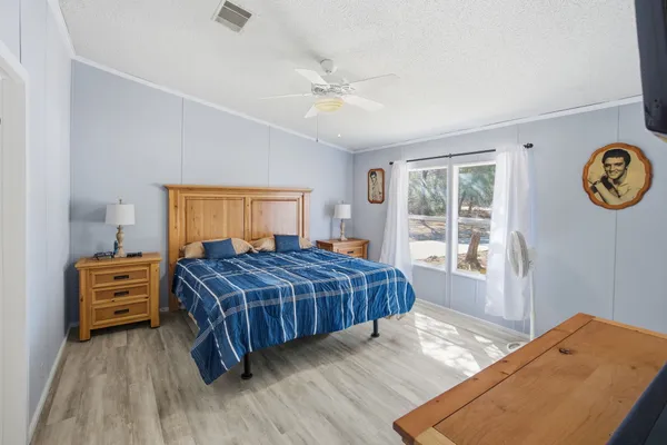 a bedroom with a bed and a dresser