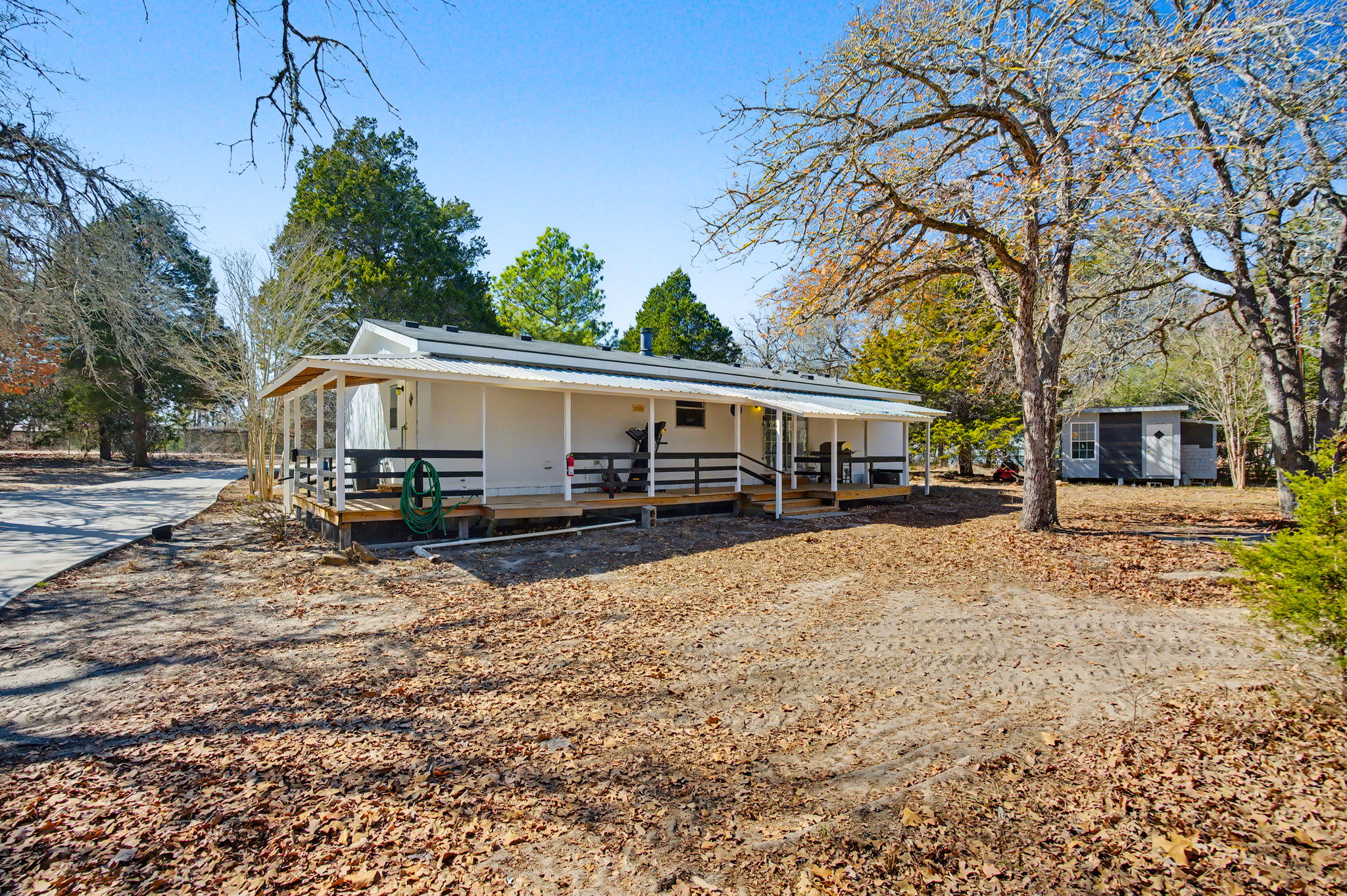 182 Wayside Court Elgin, TX 78621 - Photo 30 of 40 View of front of house featuring covered porch and roof mounted solar panels