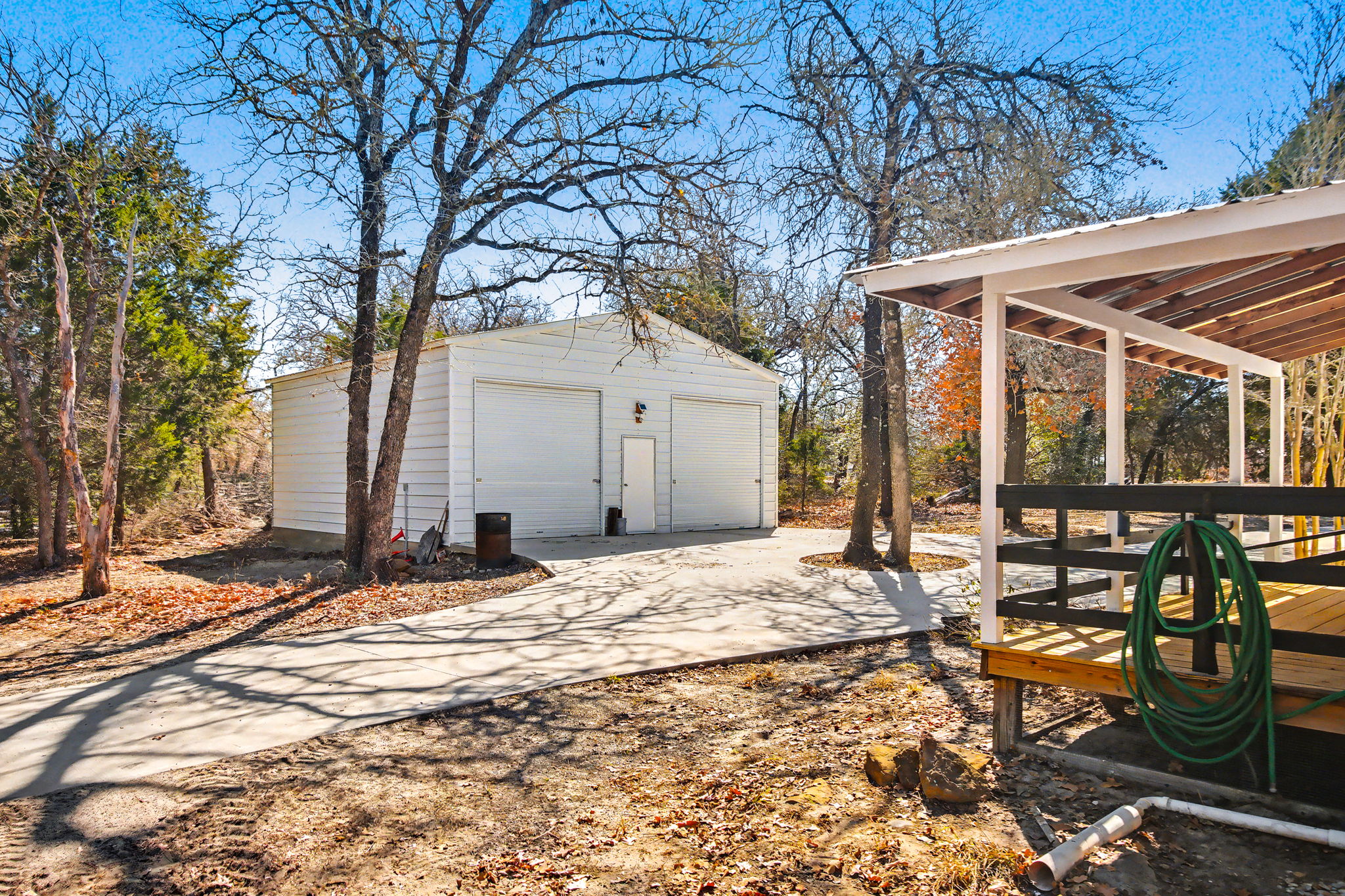 182 Wayside Court Elgin, TX 78621 - Photo 31 of 40 View of yard with a garage and an outdoor structure