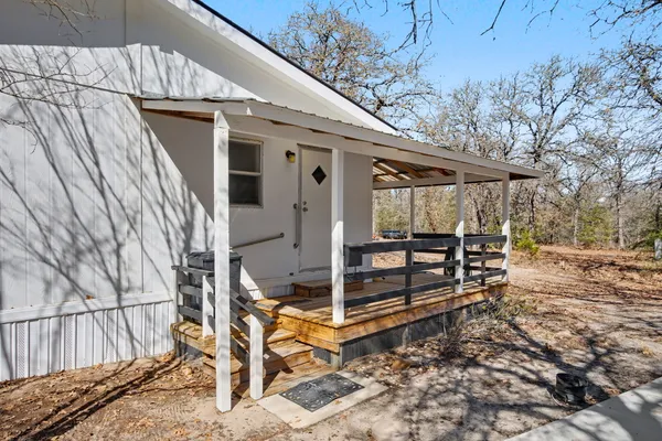 a sitting area with view of covered with wooden floor