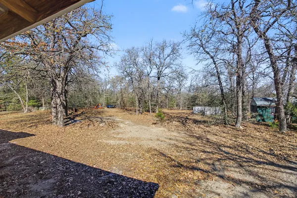 a backyard of a house with trees