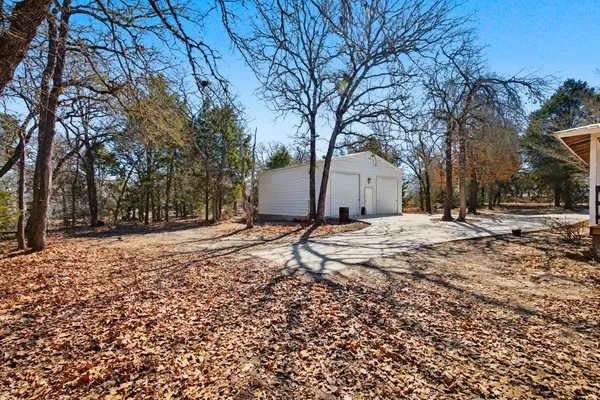 a backyard of a house with lots of green space
