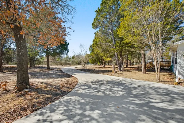 a living room with furniture fireplace and flat screen tv