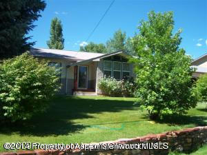 1318 East 7th Street Rifle, CO 81650 - Photo 1 of 19 a view of a house with a garden
