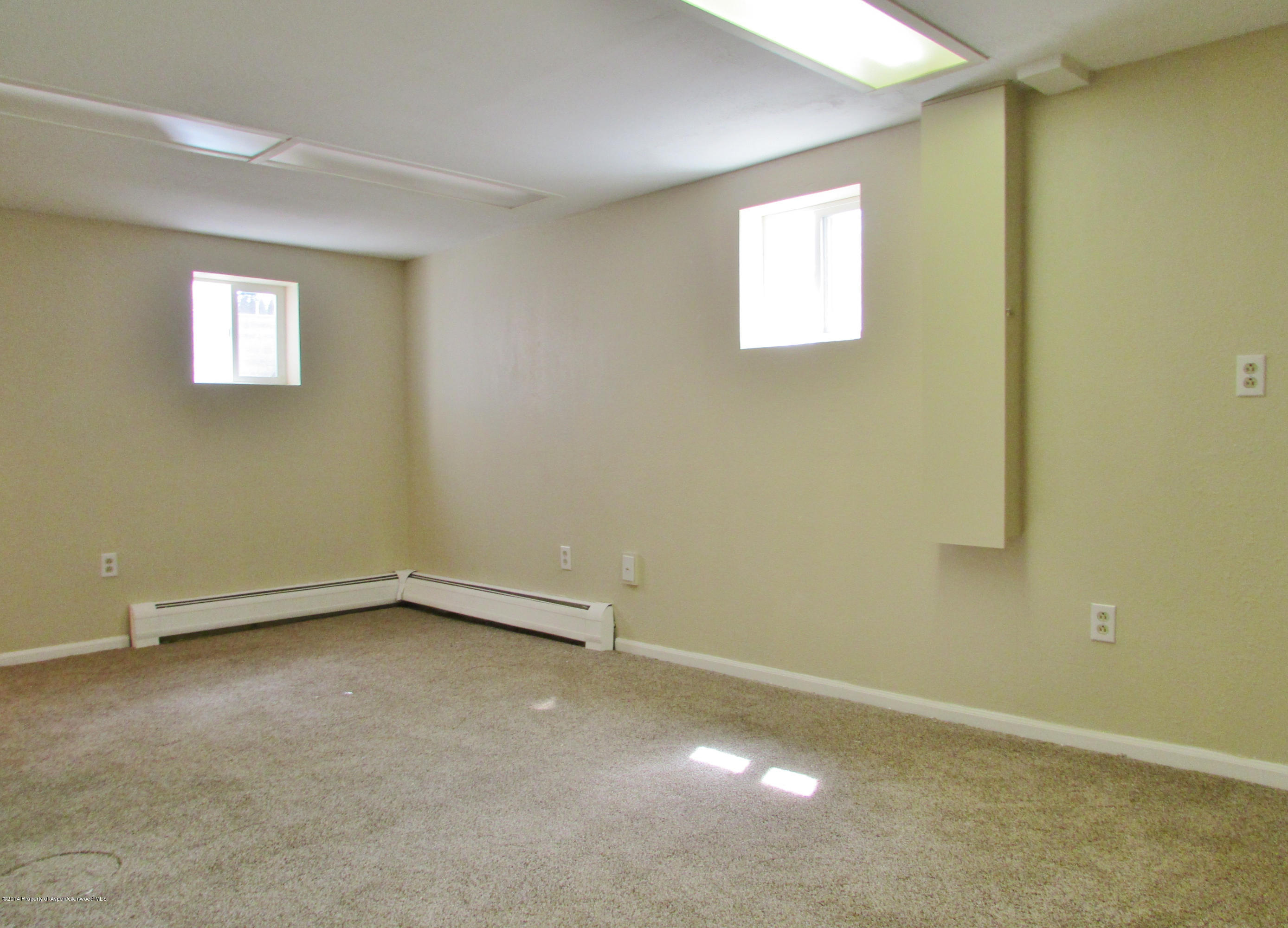 1318 East 7th Street Rifle, CO 81650 - Photo 15 of 19 an empty room with a window