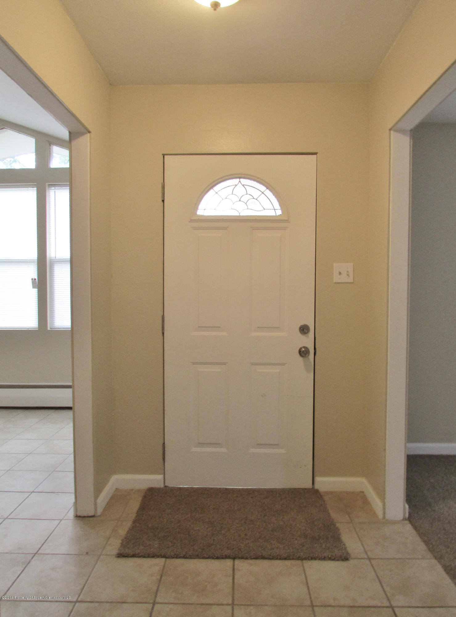 1318 East 7th Street Rifle, CO 81650 - Photo 2 of 19 an empty room with windows