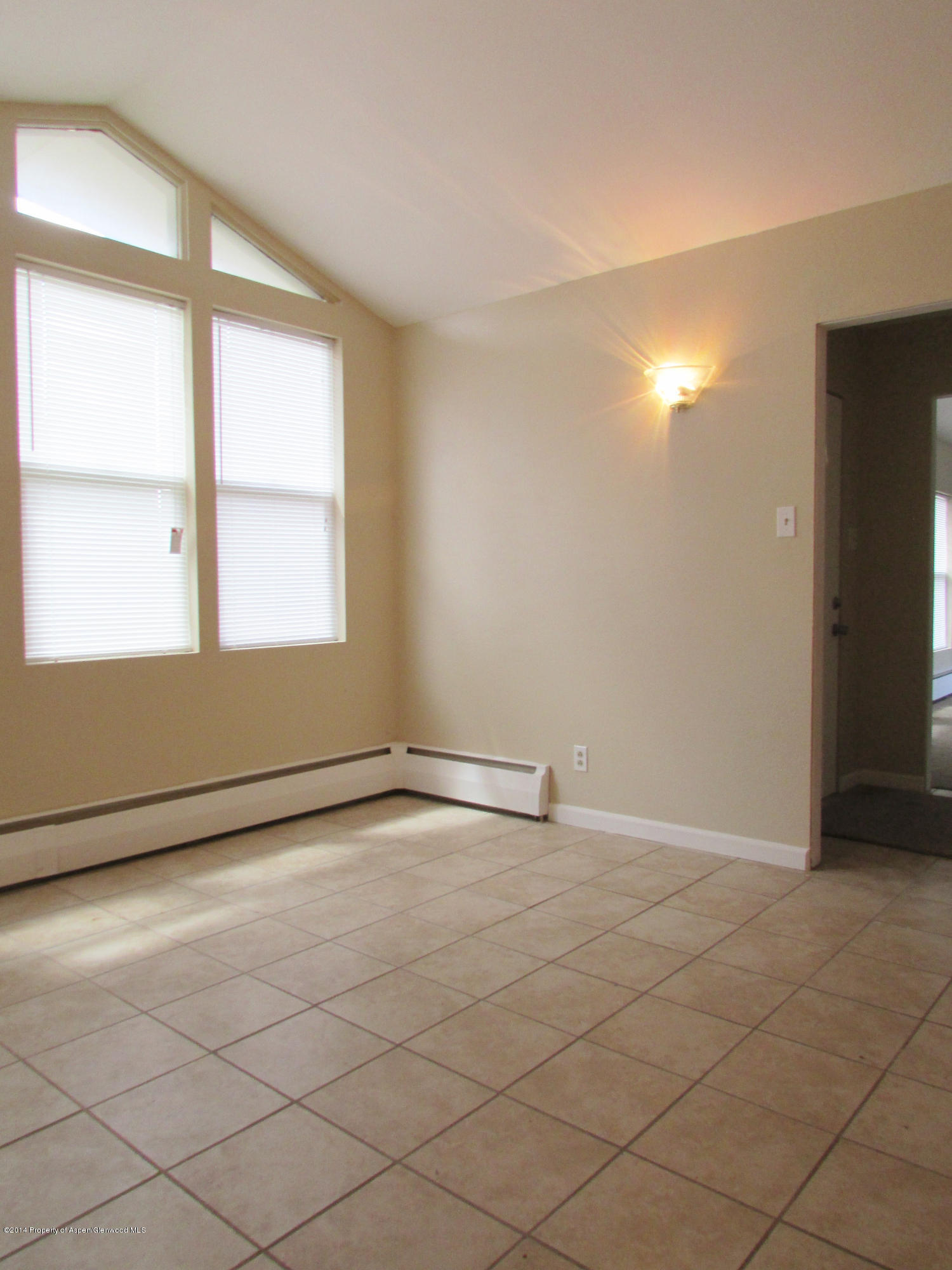 1318 East 7th Street Rifle, CO 81650 - Photo 3 of 19 an empty room with windows