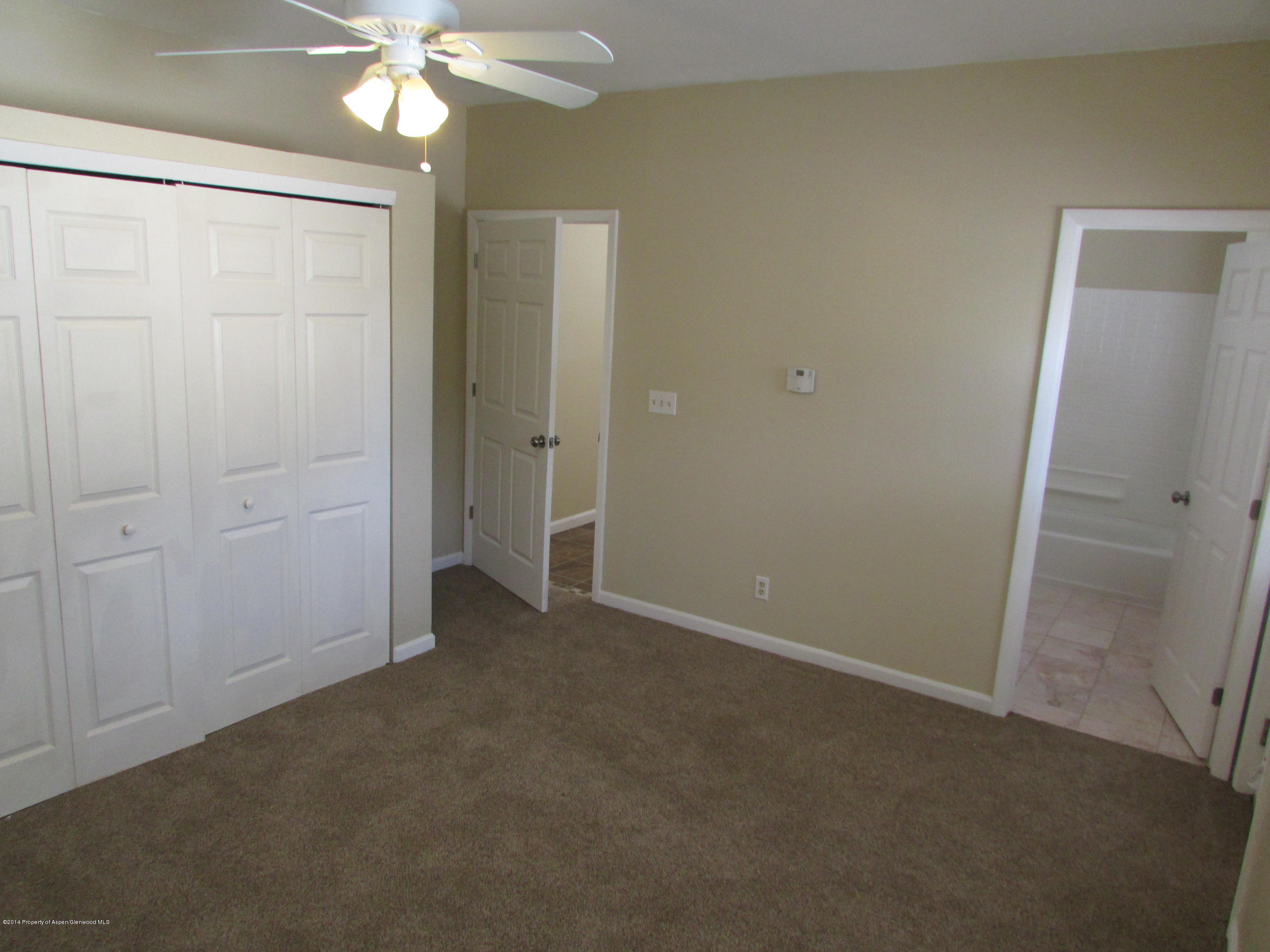1318 East 7th Street Rifle, CO 81650 - Photo 7 of 19 an empty room with a bathroom