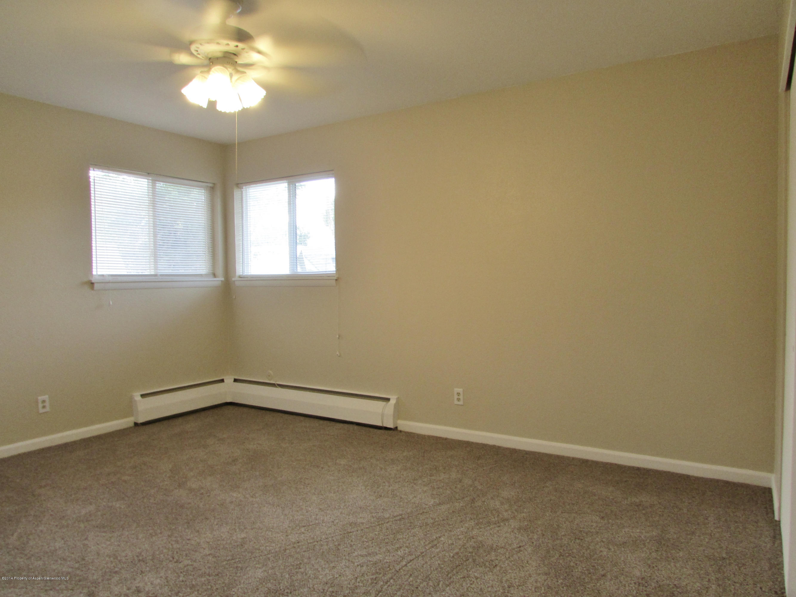 1318 East 7th Street Rifle, CO 81650 - Photo 10 of 19 an empty room with a window
