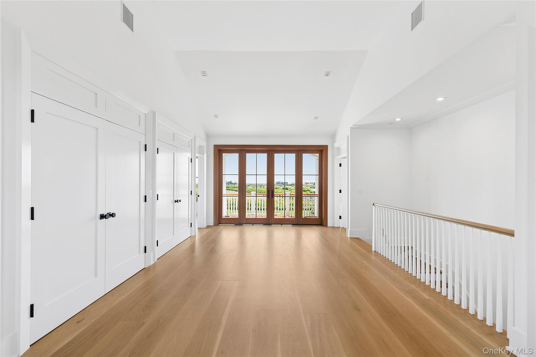 522 Wickapogue Road Southampton, NY 11968 - Photo 18 of 49 a view of a hallway with wooden floor