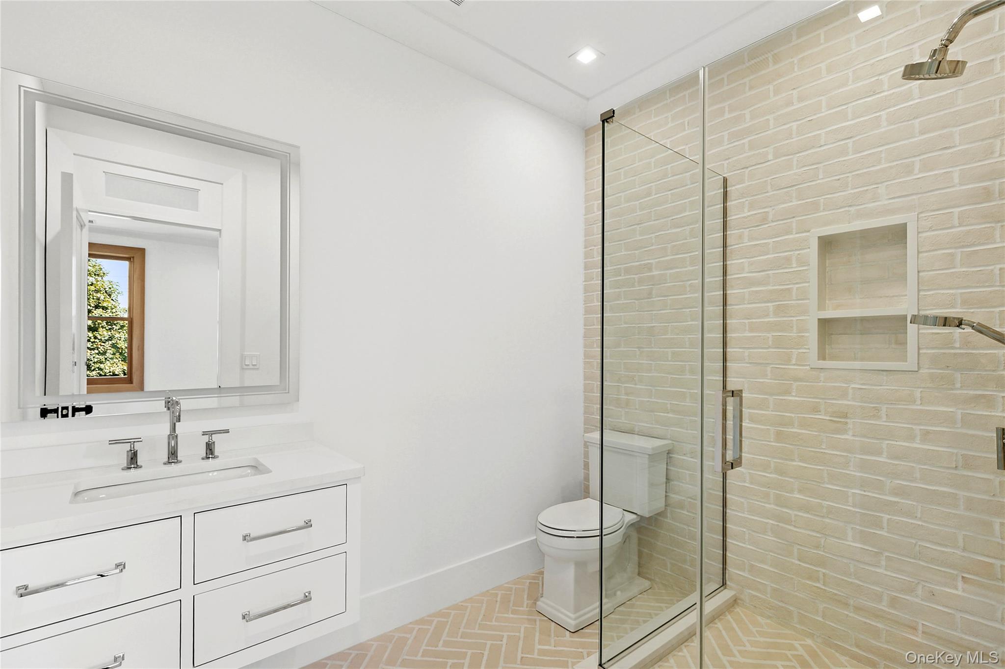 522 Wickapogue Road Southampton, NY 11968 - Photo 20 of 49 a bathroom with a granite countertop sink a toilet and a mirror