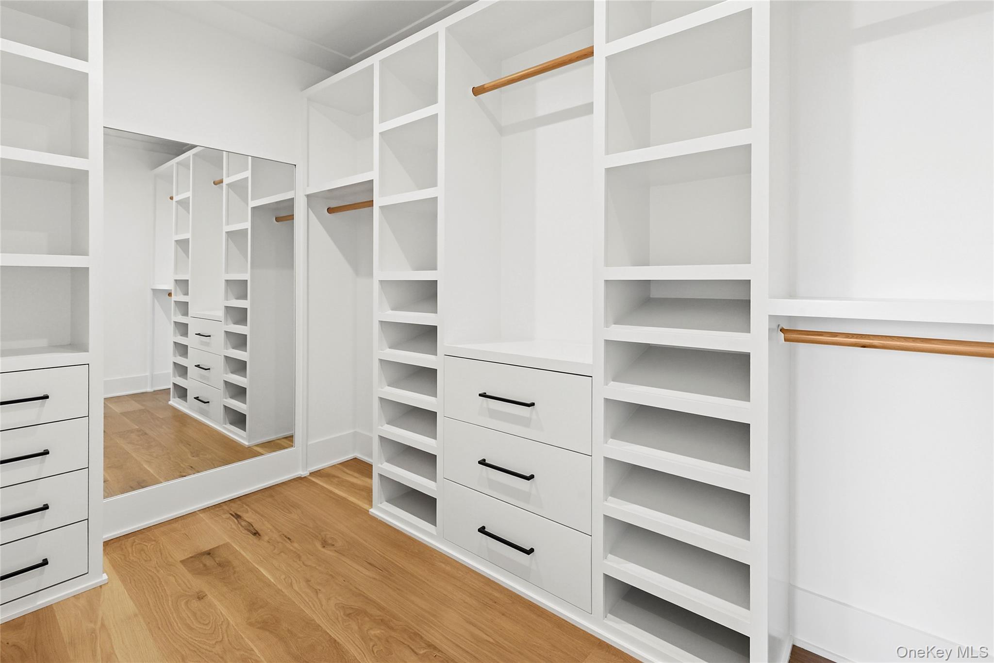 522 Wickapogue Road Southampton, NY 11968 - Photo 21 of 49 a view of walk in closet with empty racks