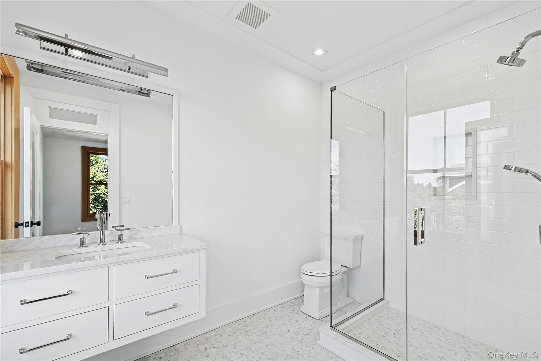 522 Wickapogue Road Southampton, NY 11968 - Photo 22 of 49 a bathroom with a double vanity sink mirror and toilet
