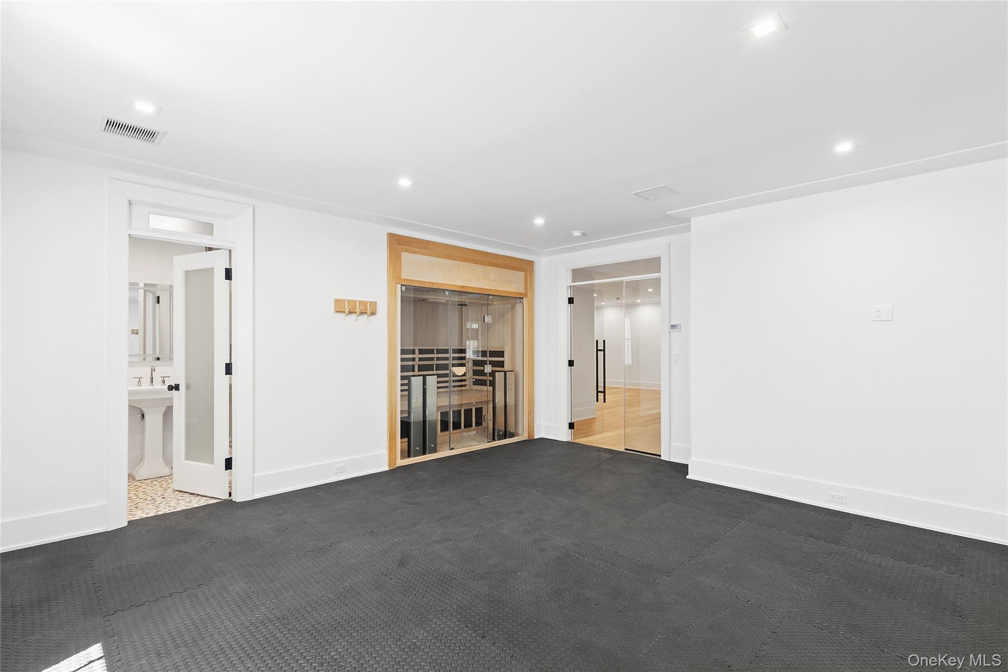 522 Wickapogue Road Southampton, NY 11968 - Photo 36 of 49 a view of a livingroom with an empty space and a window