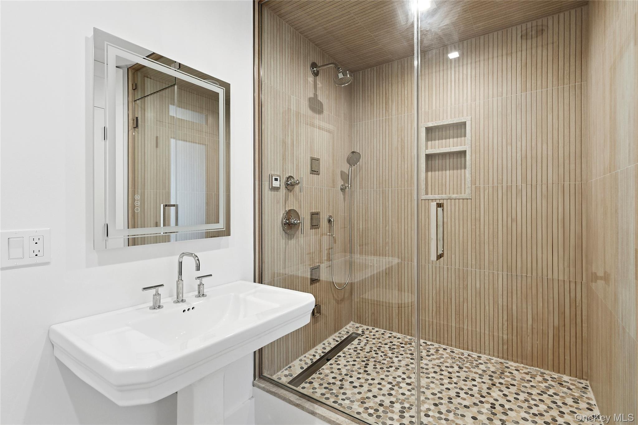 522 Wickapogue Road Southampton, NY 11968 - Photo 37 of 49 a bathroom with a sink a toilet and shower