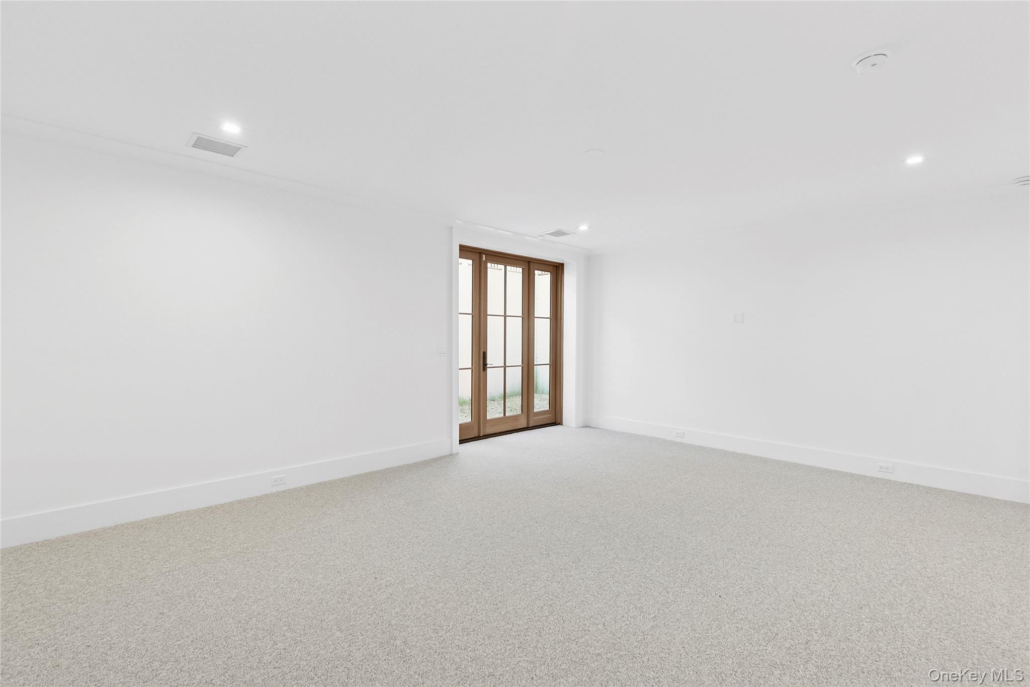 522 Wickapogue Road Southampton, NY 11968 - Photo 39 of 49 an empty room with windows