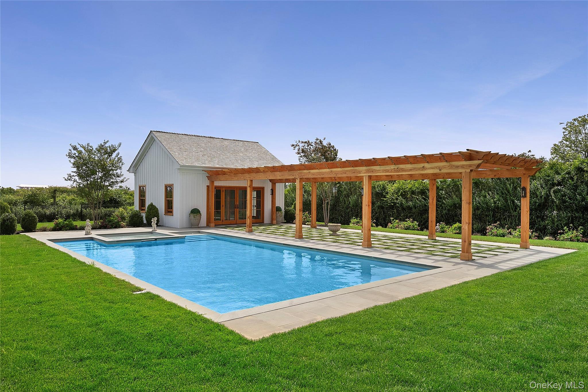522 Wickapogue Road Southampton, NY 11968 - Photo 46 of 49 swimming pool view with a seating space and a view of a house
