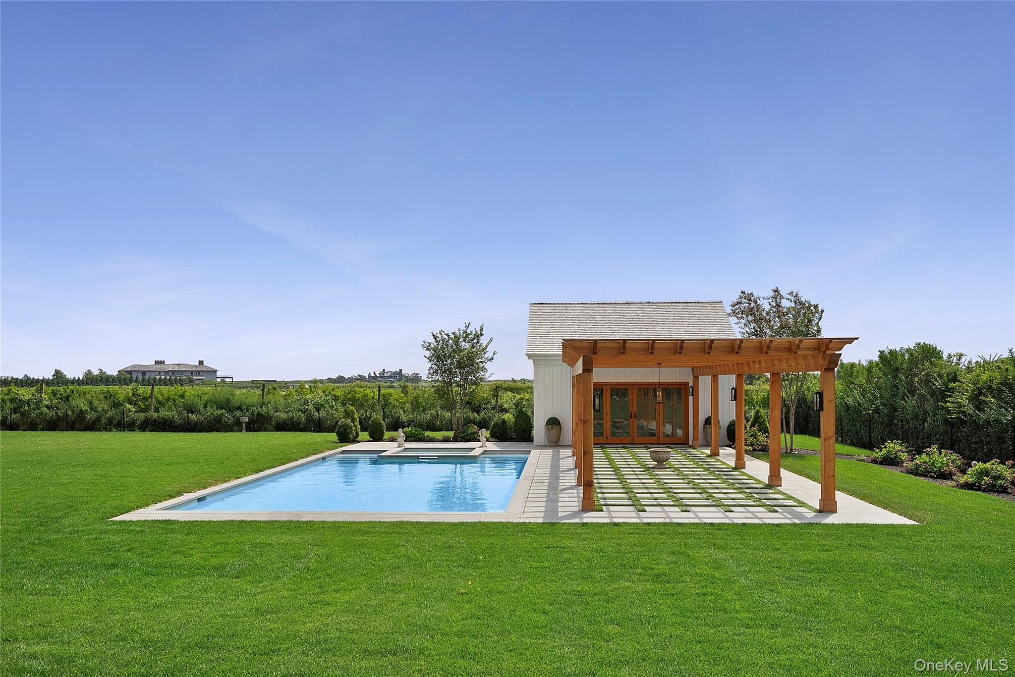 522 Wickapogue Road Southampton, NY 11968 - Photo 49 of 49 a view of a house with swimming pool and a yard