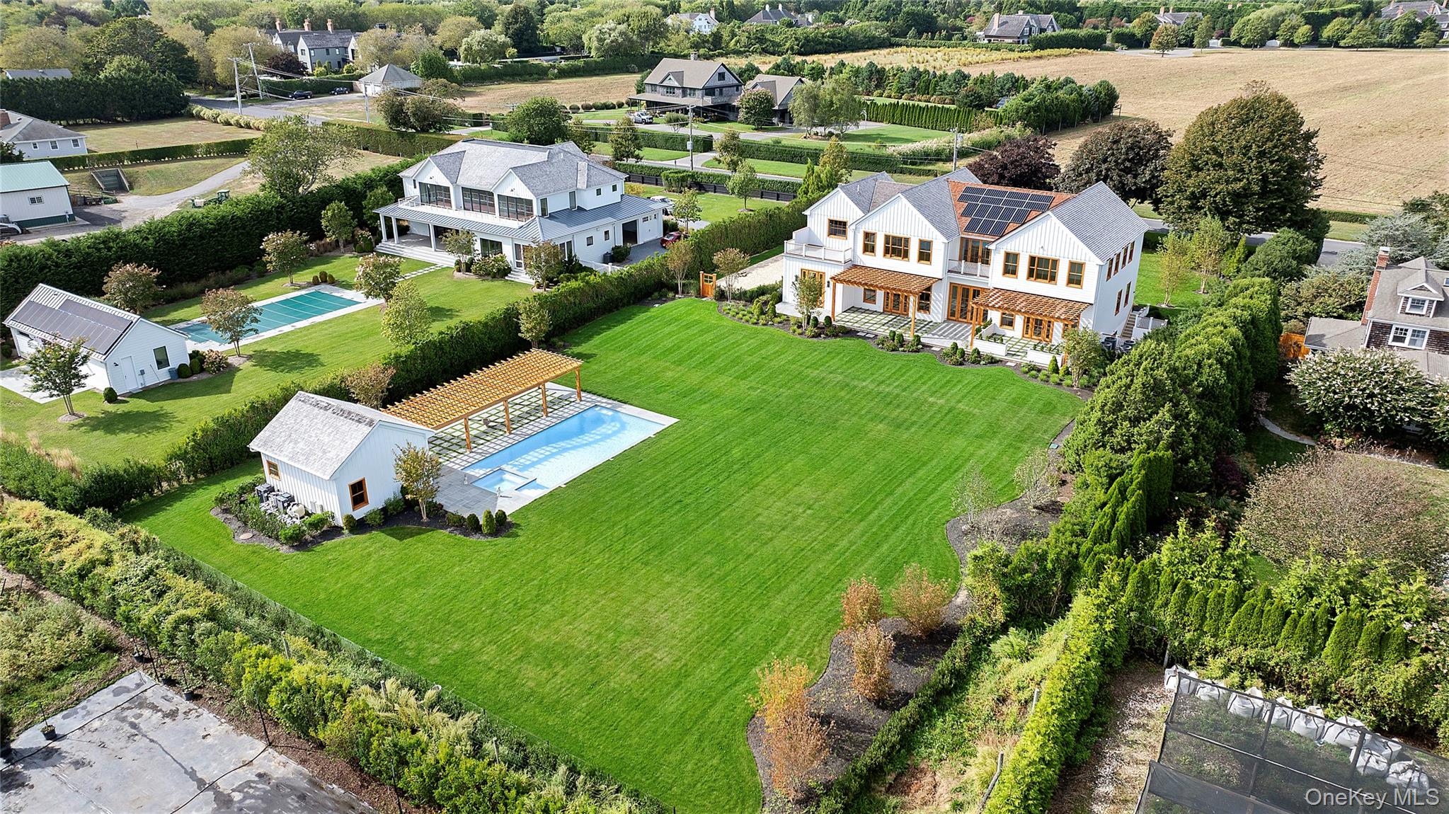 522 Wickapogue Road Southampton, NY 11968 - Photo 5 of 49 an aerial view of a house with garden space and street view