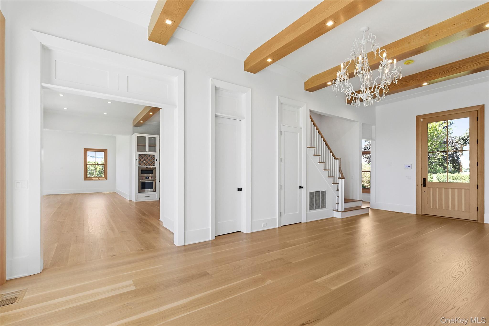 522 Wickapogue Road Southampton, NY 11968 - Photo 8 of 49 wooden floor in an empty room with a window
