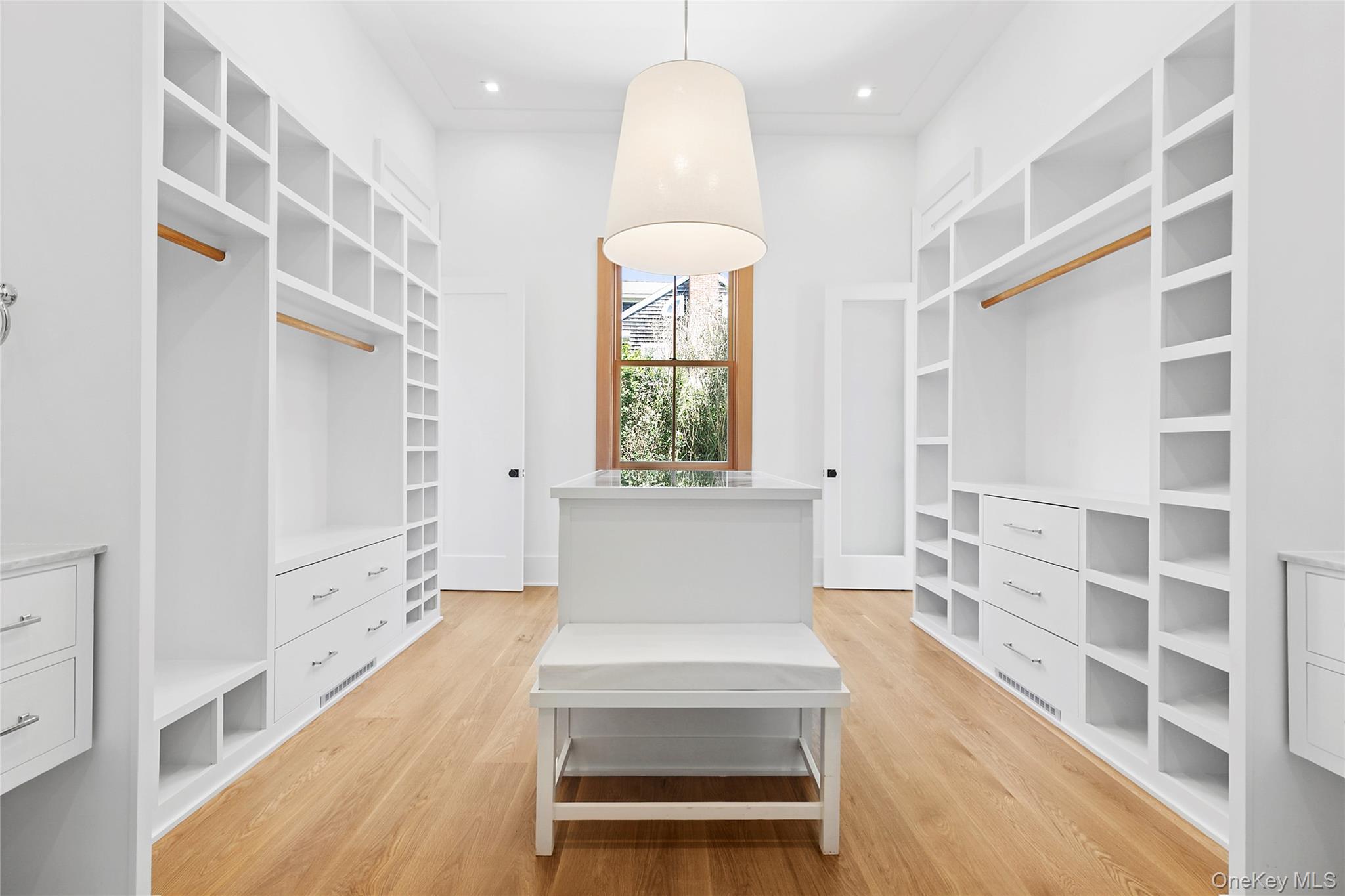 522 Wickapogue Road Southampton, NY 11968 - Photo 10 of 49 a view of an entryway with wooden floor and windows