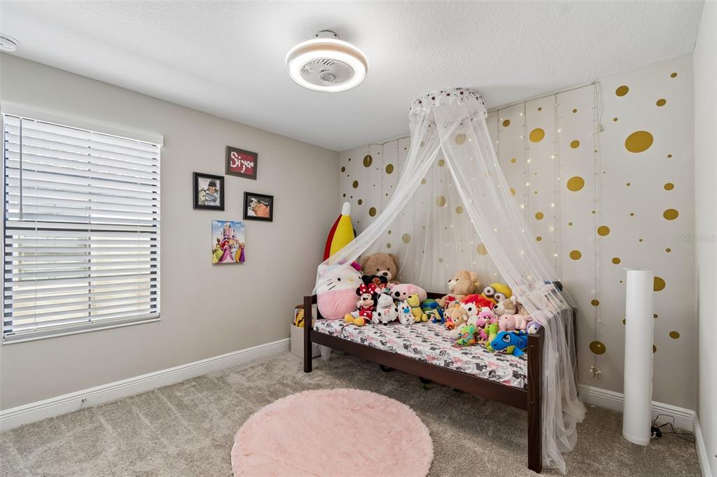 4300 Burdick Loop Odessa, FL 33556 - Photo 20 of 41 a room with toys and white walls