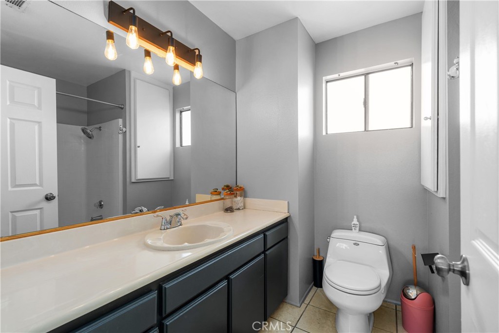 69646 Antonia Way Rancho Mirage, CA 92270 - Photo 43 of 50 a bathroom with a granite countertop sink toilet and a mirror