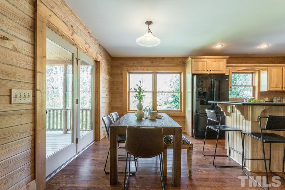 307 November Drive Durham, NC 27712 - Photo 11 of 30 a view of a dining room with furniture window and wooden floor