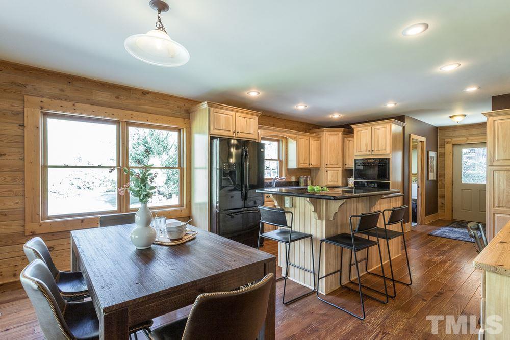 307 November Drive Durham, NC 27712 - Photo 12 of 30 a view of a dining room with furniture window and wooden floor