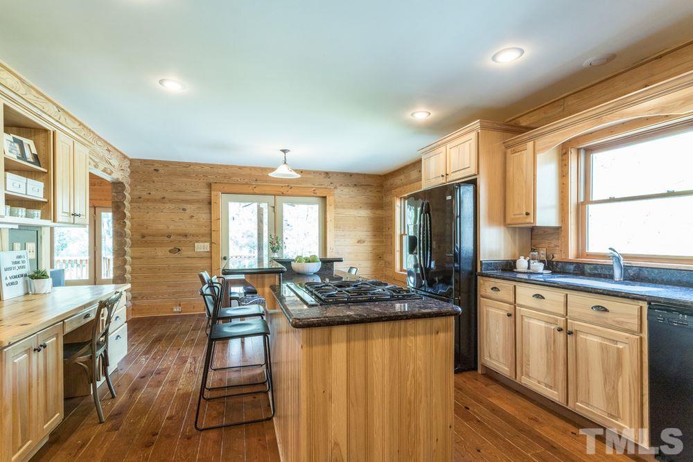 307 November Drive Durham, NC 27712 - Photo 13 of 30 a kitchen with granite countertop lots of counter top space and stainless steel appliances