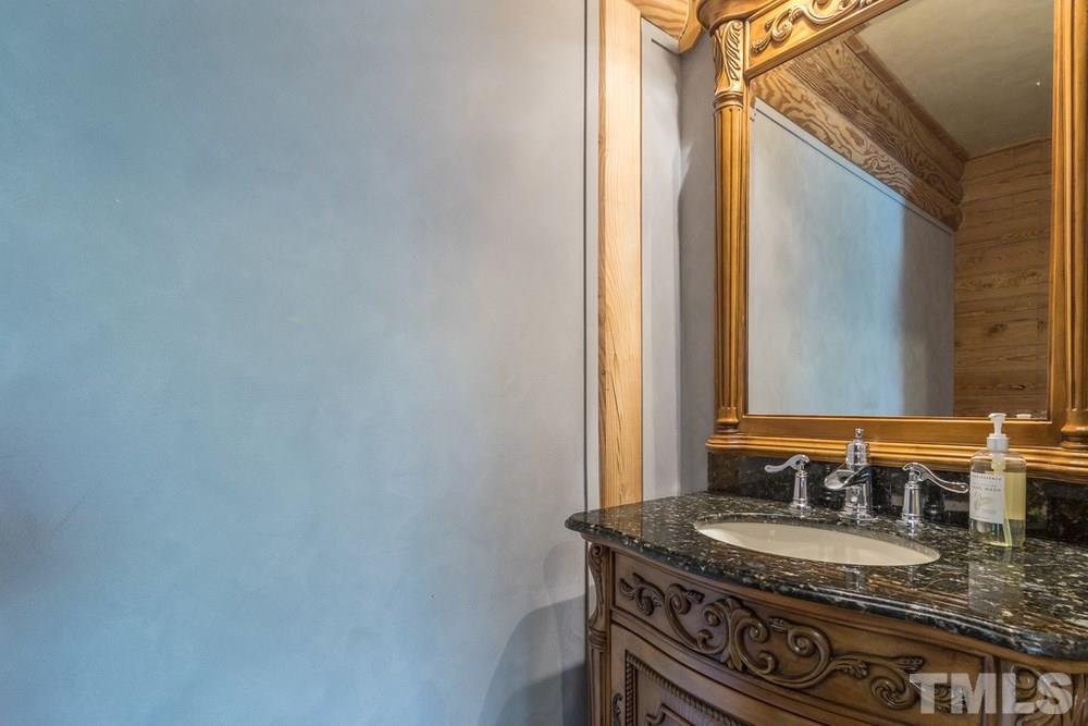 307 November Drive Durham, NC 27712 - Photo 19 of 30 a bathroom with a granite countertop sink and a mirror