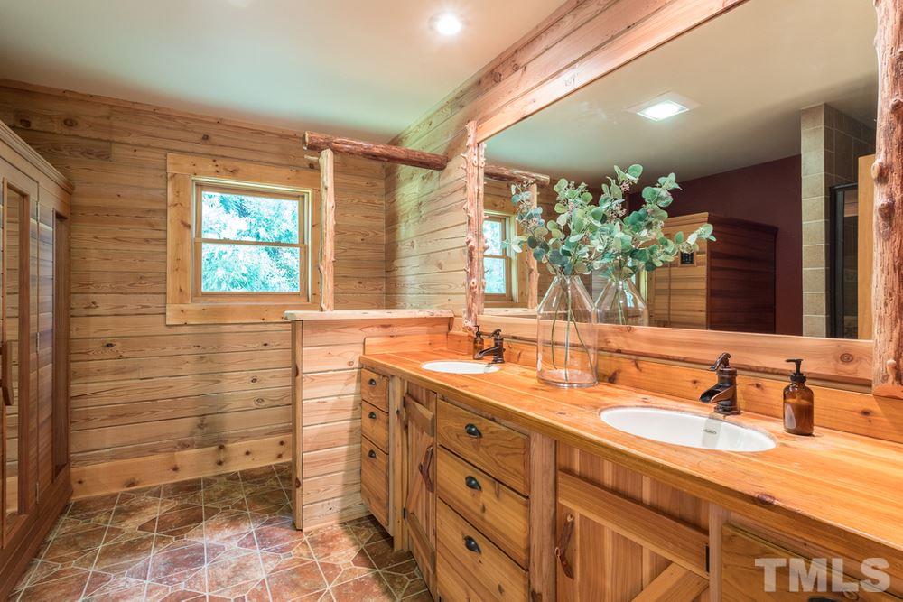 307 November Drive Durham, NC 27712 - Photo 21 of 30 a bathroom with a granite countertop sink mirror and a