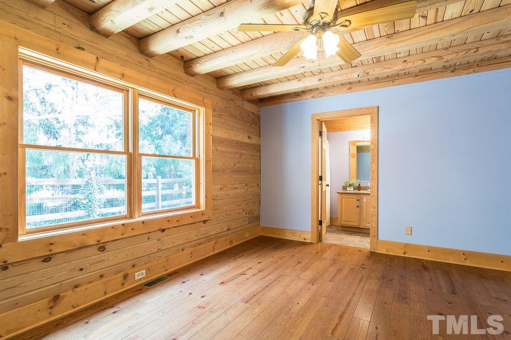 307 November Drive Durham, NC 27712 - Photo 24 of 30 an empty room with wooden floor and windows