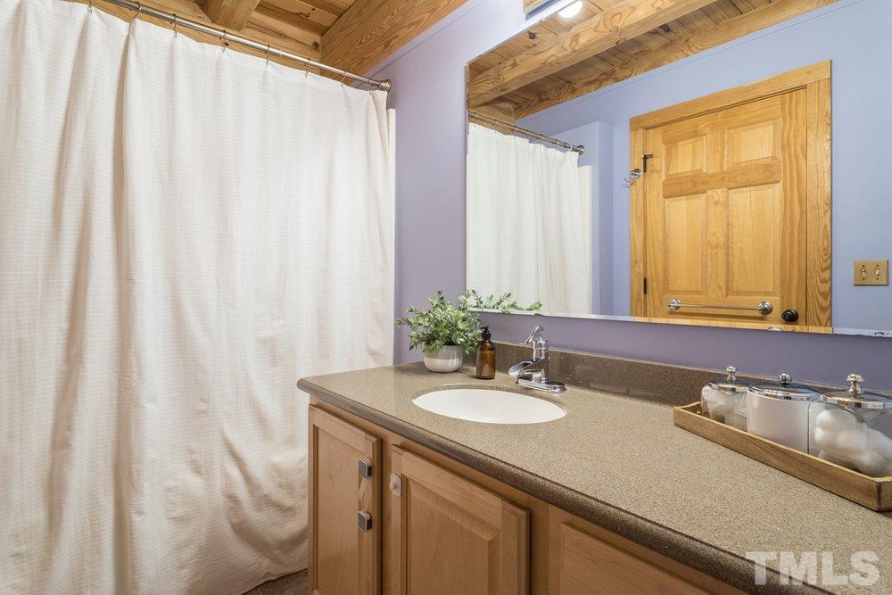 307 November Drive Durham, NC 27712 - Photo 25 of 30 a bathroom with a sink and a mirror
