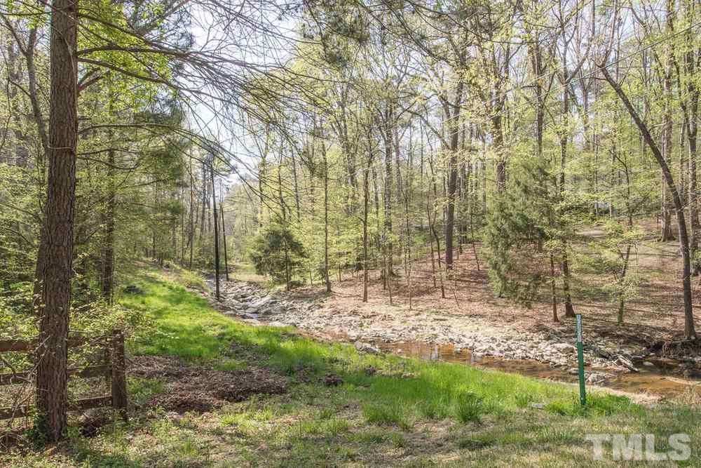 307 November Drive Durham, NC 27712 - Photo 6 of 30 a view of a yard with trees in the background