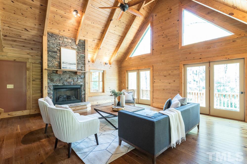 307 November Drive Durham, NC 27712 - Photo 7 of 30 a living room with fireplace furniture and a large window