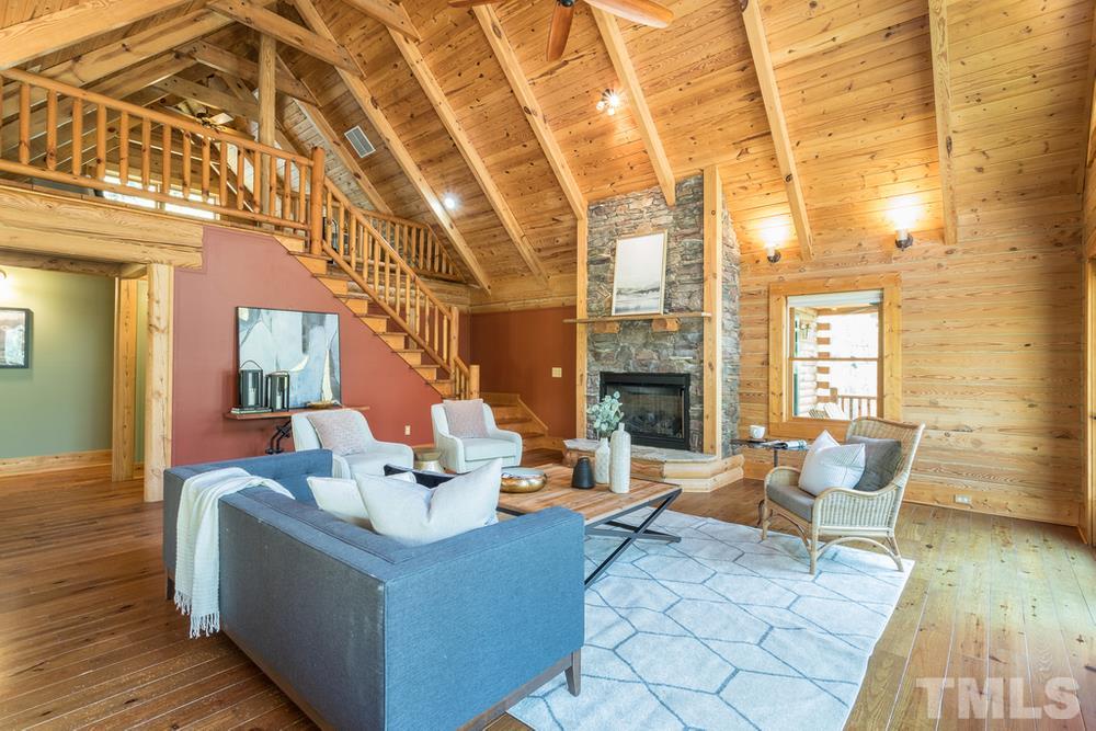 307 November Drive Durham, NC 27712 - Photo 9 of 30 a living room with fireplace furniture and a wooden floor