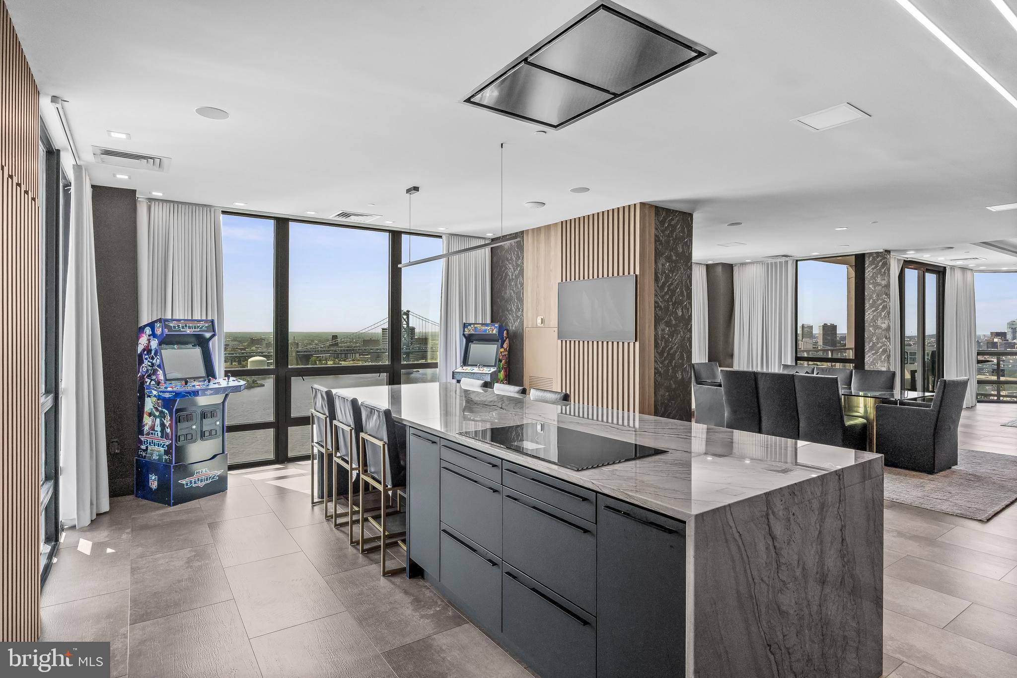 901 North Penn Street, Unit P24012 Philadelphia, PA 19123 - Photo 11 of 59 a room with gym equipment and large windows