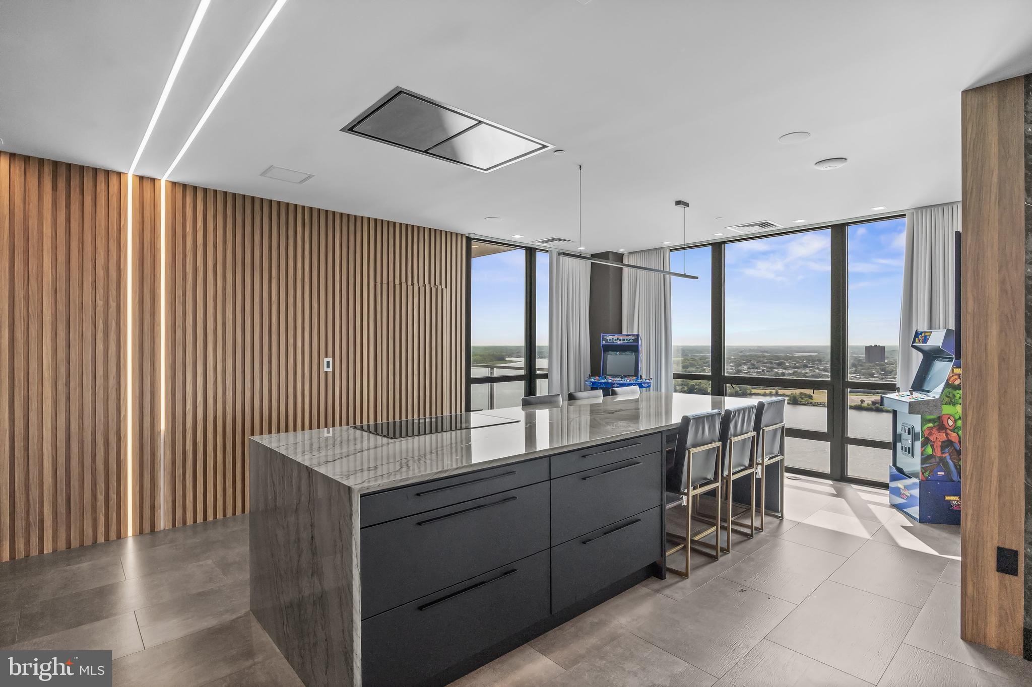 901 North Penn Street, Unit P24012 Philadelphia, PA 19123 - Photo 16 of 59 a room with a large bed and a view of living room