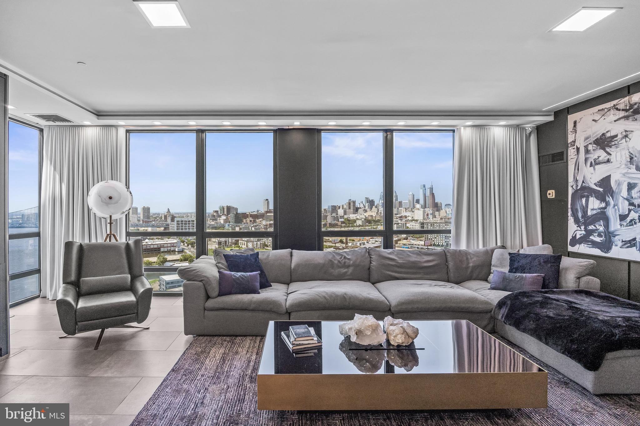 901 North Penn Street, Unit P24012 Philadelphia, PA 19123 - Photo 18 of 59 a living room with furniture and a large window