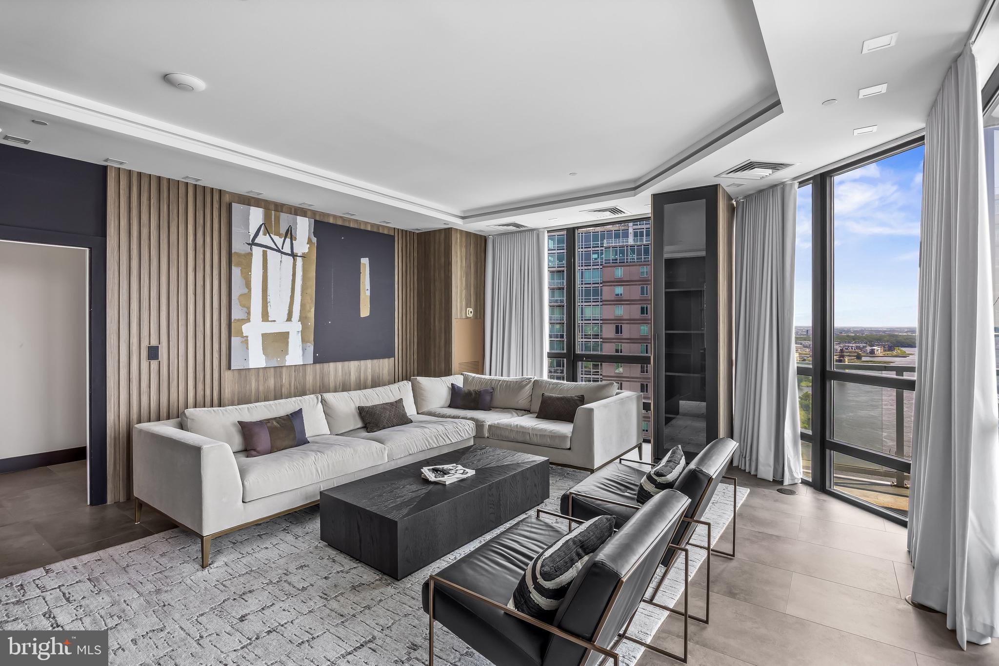 901 North Penn Street, Unit P24012 Philadelphia, PA 19123 - Photo 24 of 59 a living room with furniture and large windows