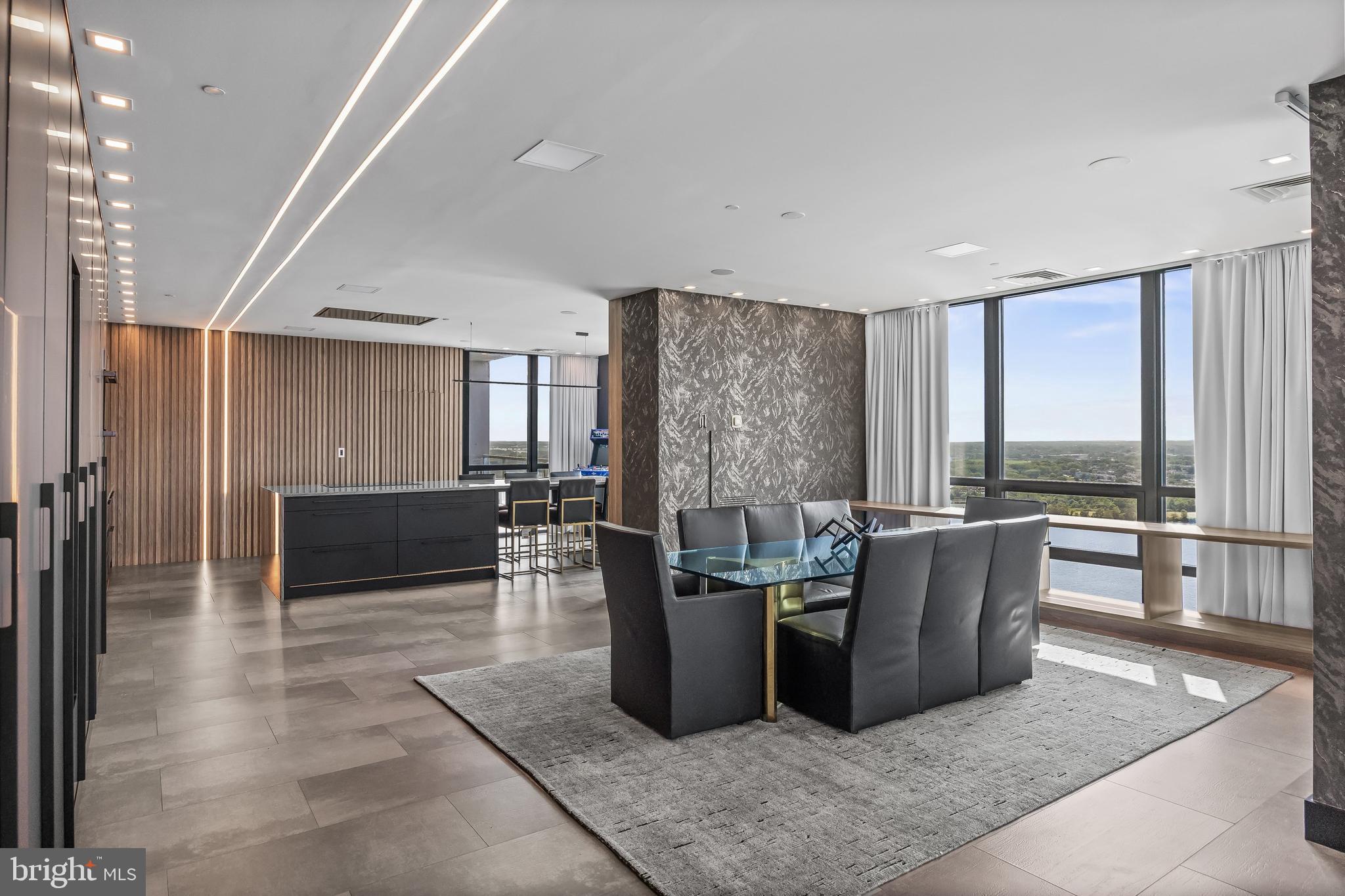 901 North Penn Street, Unit P24012 Philadelphia, PA 19123 - Photo 25 of 59 a living room with furniture a large window and wooden floor