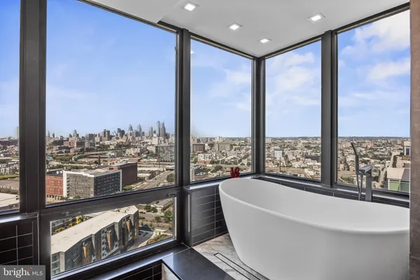 a bathroom with a double vanity sink a mirror and a shower