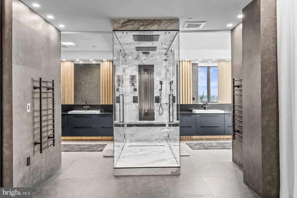 a bathroom with a double vanity sink and a mirror