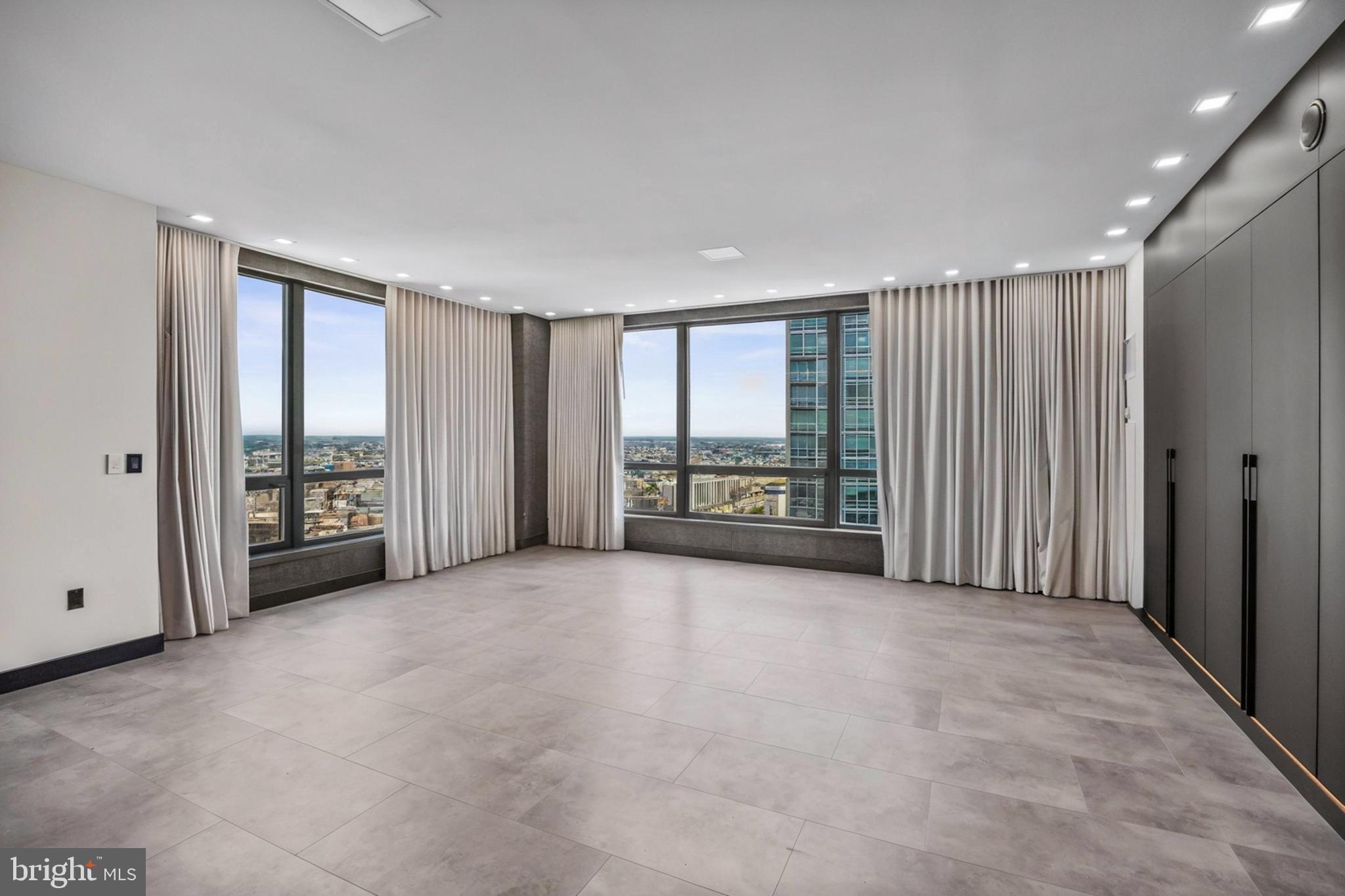 901 North Penn Street, Unit P24012 Philadelphia, PA 19123 - Photo 32 of 59 a view of an empty room with a sliding door