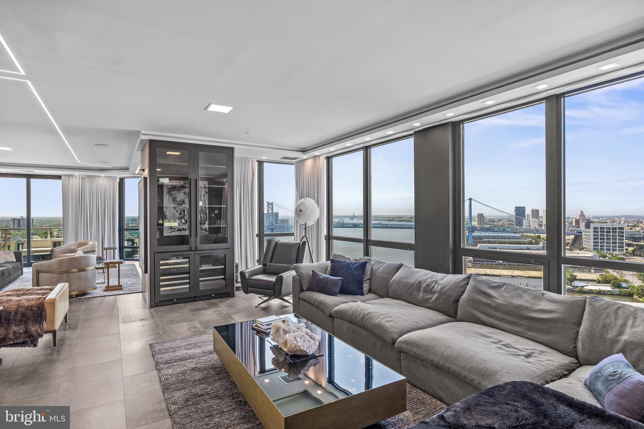 901 North Penn Street, Unit P24012 Philadelphia, PA 19123 - Photo 7 of 59 a living room with furniture and a floor to ceiling window