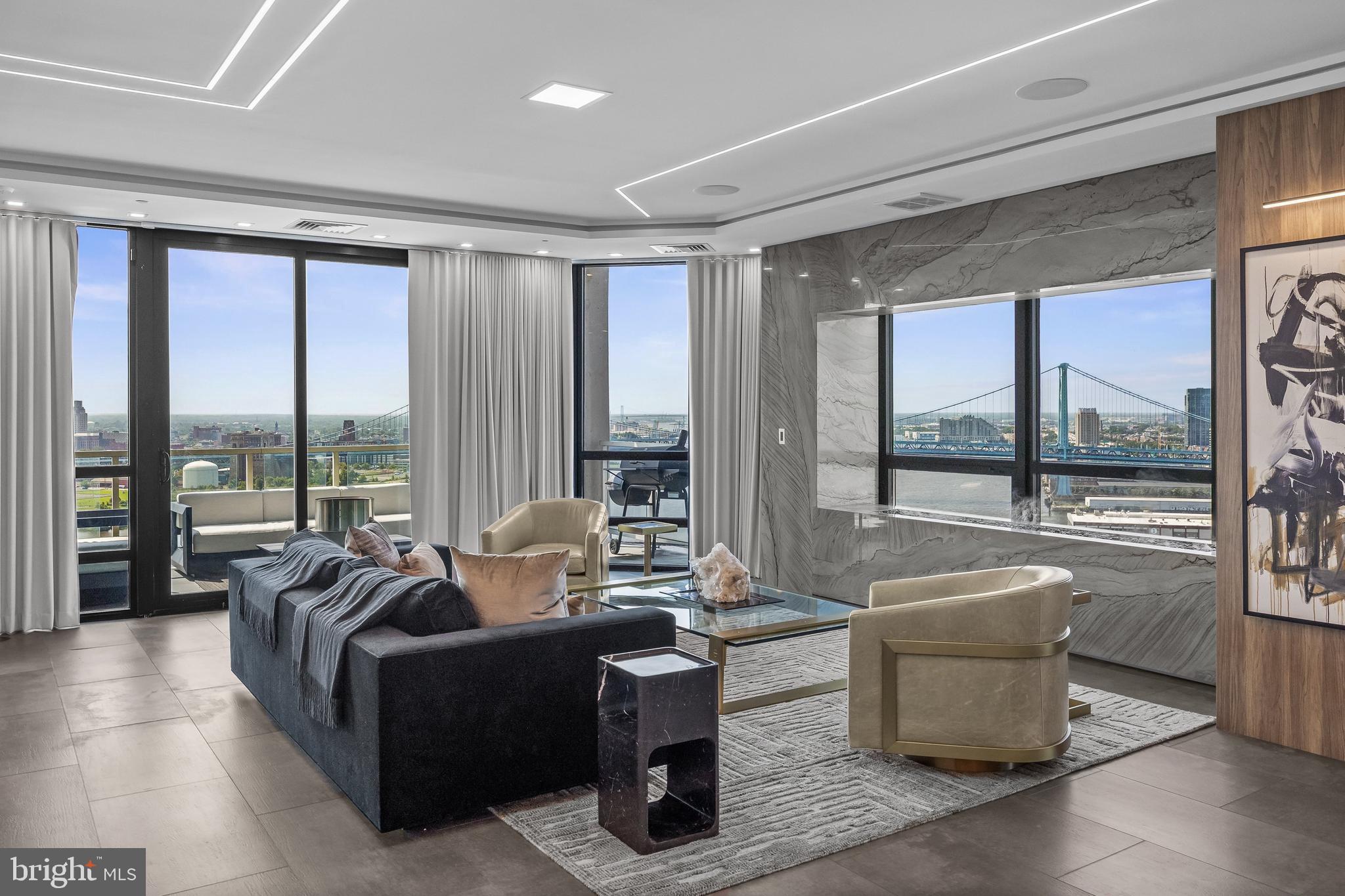 901 North Penn Street, Unit P24012 Philadelphia, PA 19123 - Photo 10 of 59 a living room with furniture and a large window